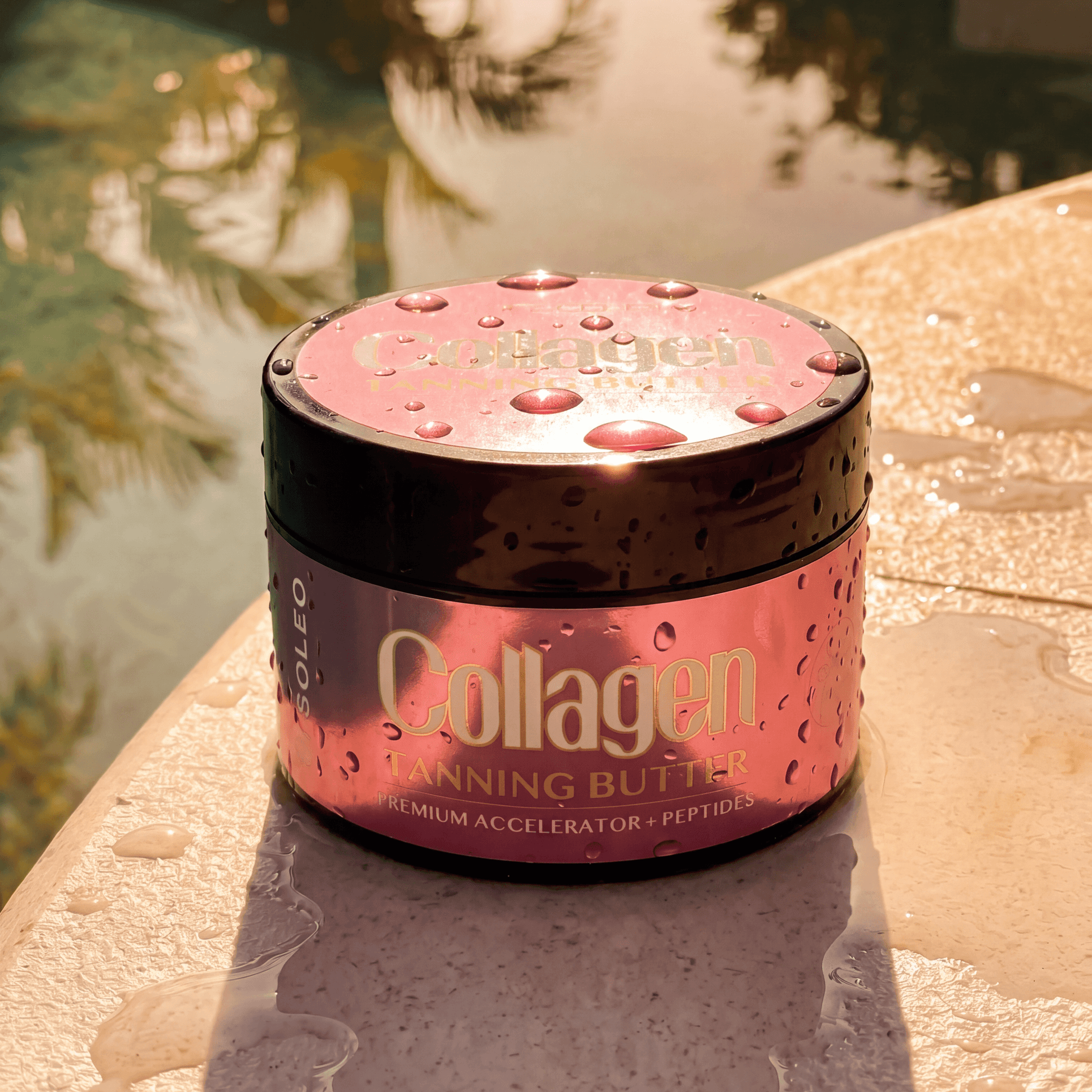 Soleo Collagen Tanning Butter Accelerator on wet stone surface with water droplets