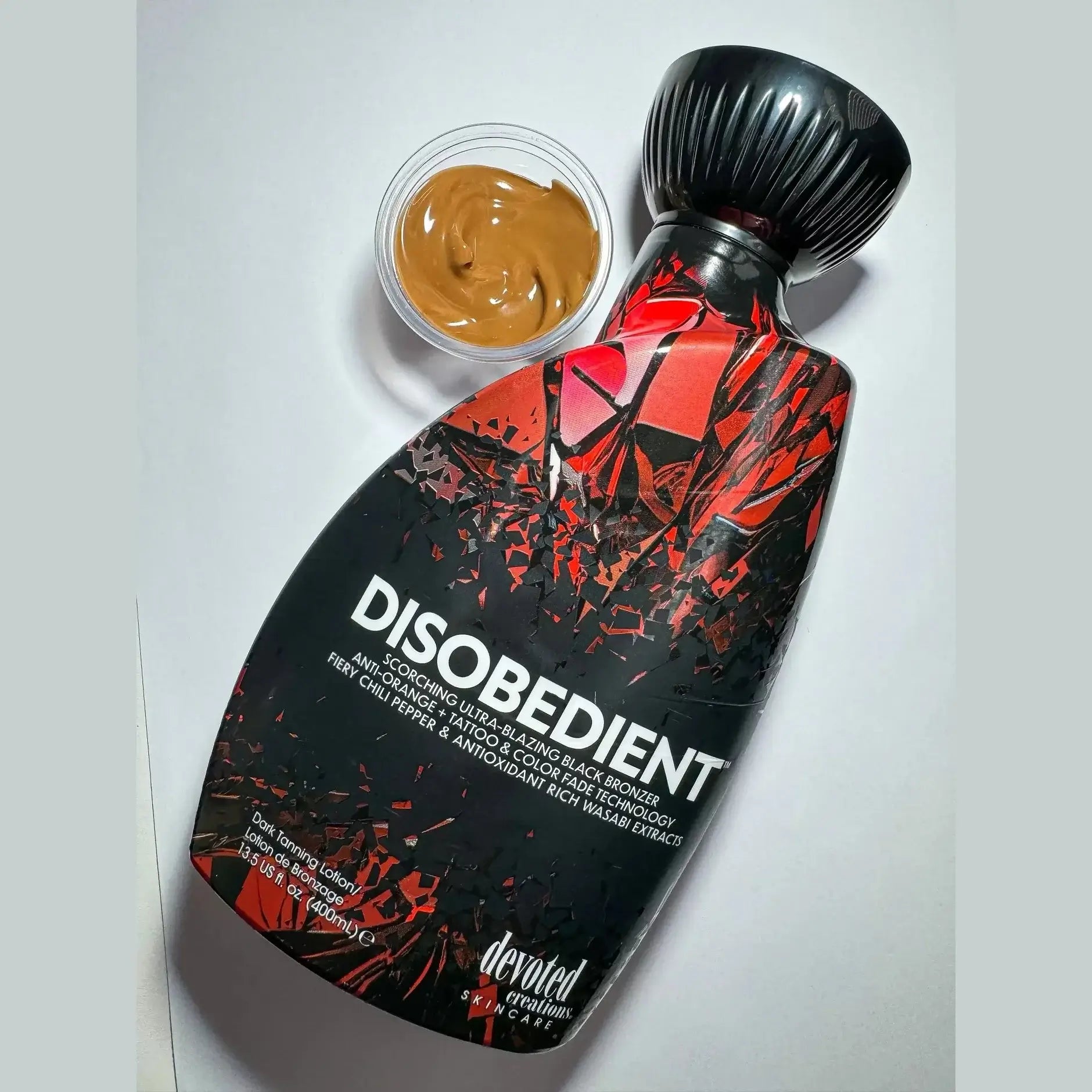 Cream for solarium Devoted Creations Disobedient, Ultra-Blazing Black Tan Lotion with chili pepper and wasabi extracts, 400 ml