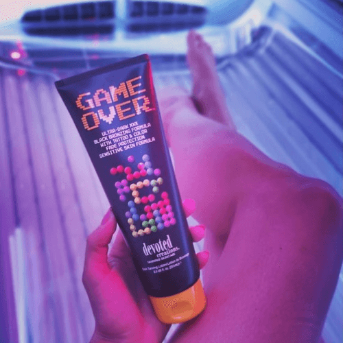 Cream for solarium Devoted Creations Game Over, for ultra-dark tan, with cocoa, shea butter, sensitive skin formula, 251 ml