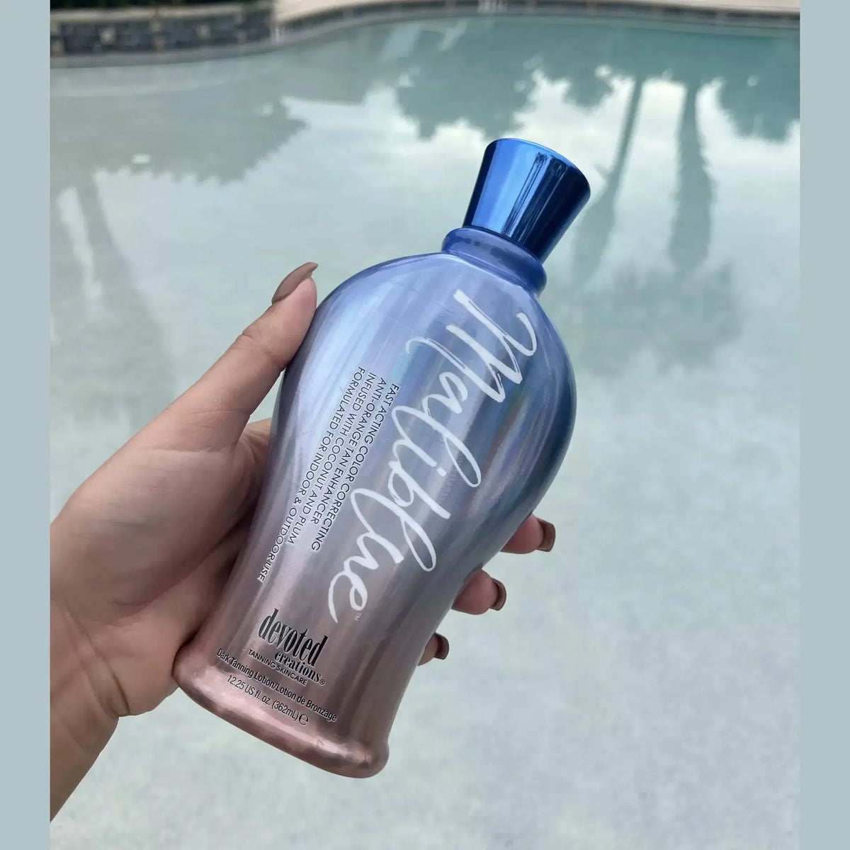 Devoted Creations Maliblue fast acting tan accelerator with coconut oil in iridescent blue bottle