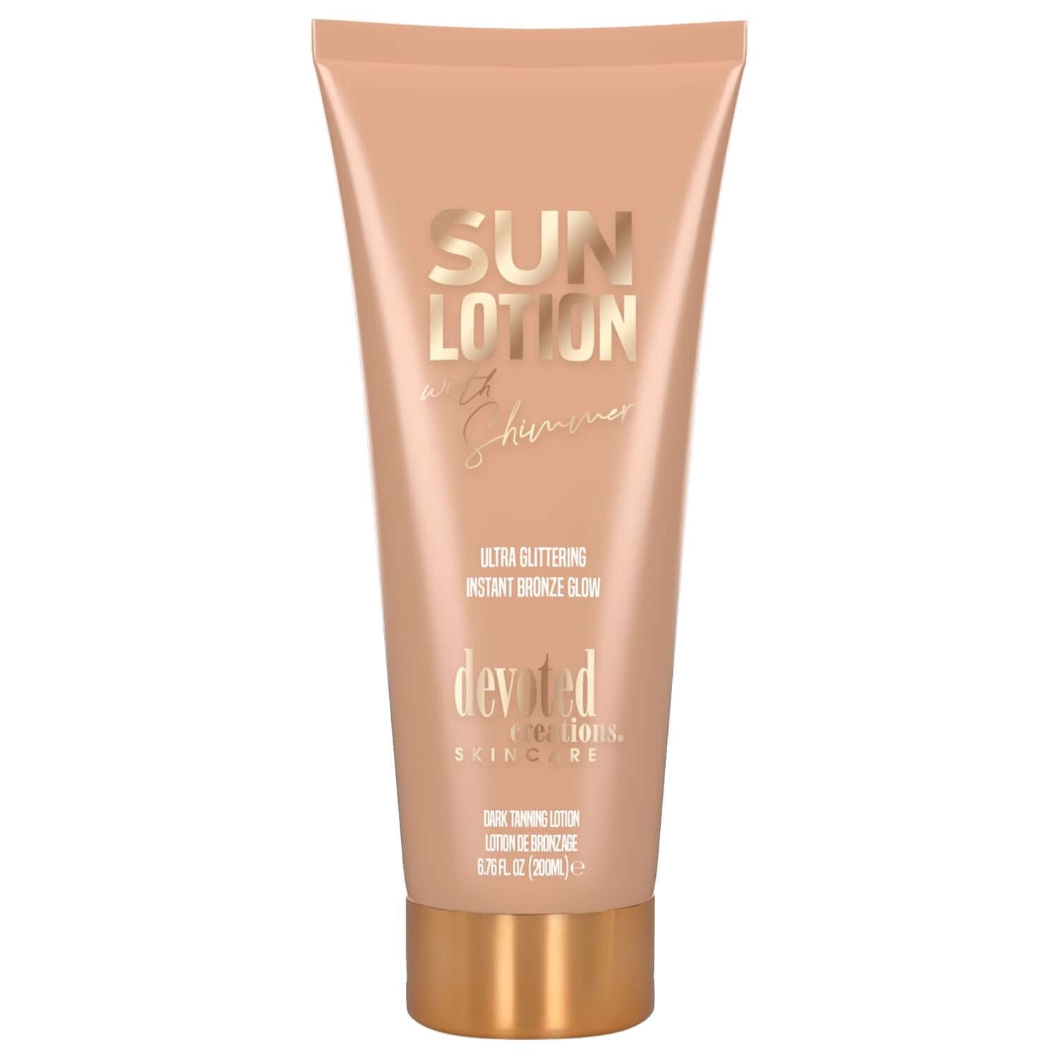 Peach Devoted Creations sun lotion tube with gold cap and glittering glow