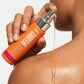 Golden dry oil texture of Inky Carotene Bomb on shoulder