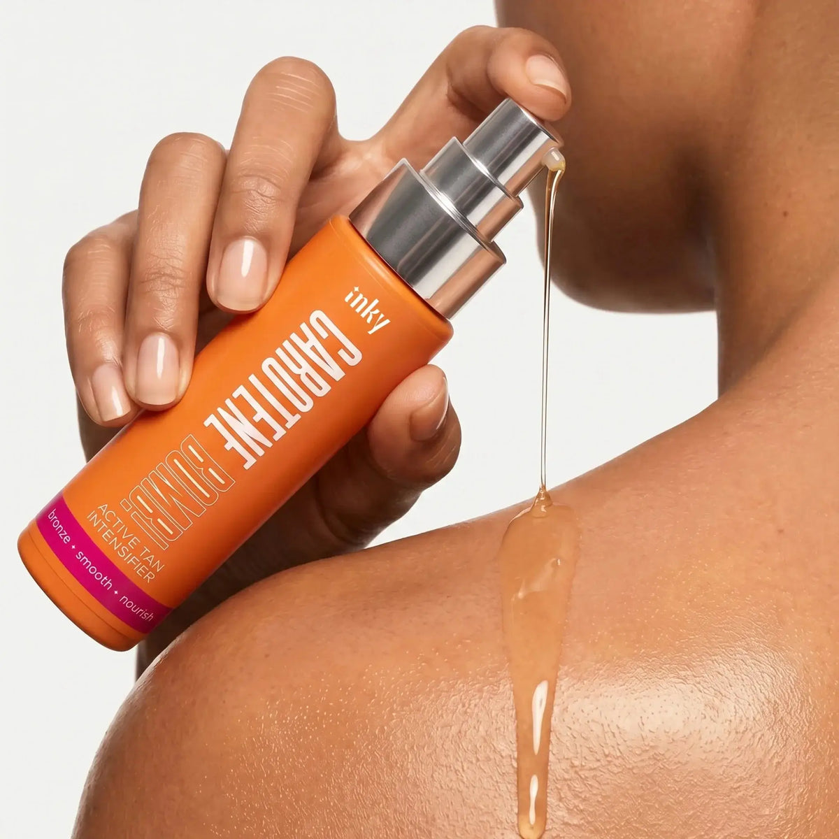 Golden dry oil texture of Inky Carotene Bomb on shoulder