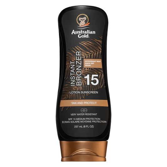 Australian Gold SPF 15 Instant Bronzer sunscreen lotion in black bottle with bronze cap