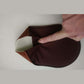 Brown reusable tanning mitt interior lining and pliable texture detail